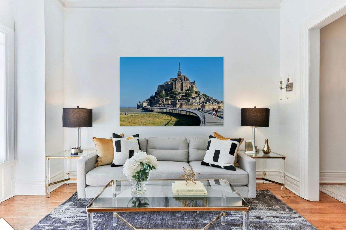 Tourists walking along the path to Mont Saint Michel in Normandy