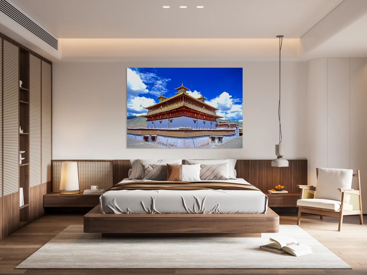 Golden roof of ancient Tibetan monastery under blue sky