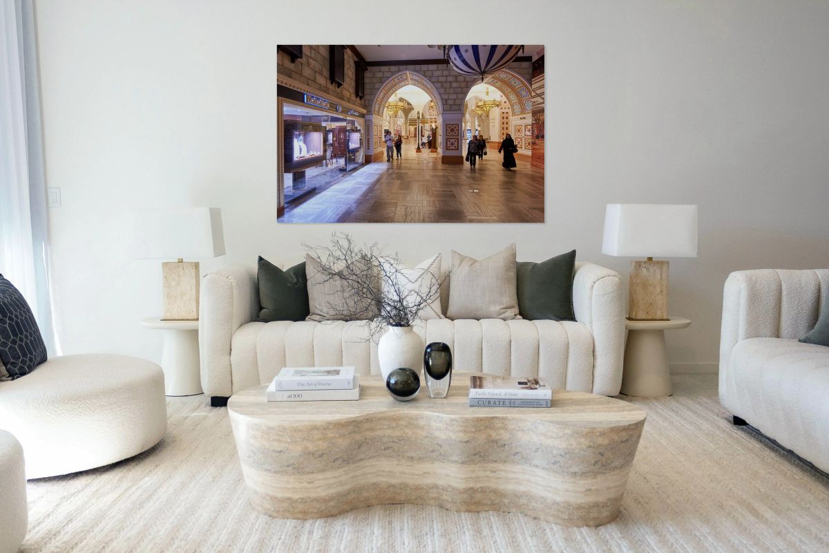 Shoppers explore stores in an Arabian themed mall in Dubai UAE