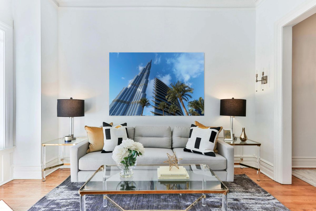 Burj Khalifa among modern buildings and palm trees in Dubai