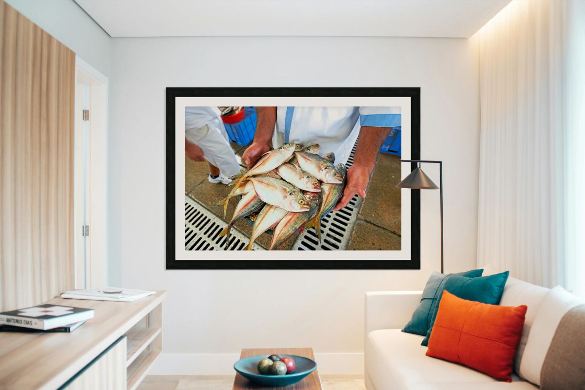 Freshly caught fish in Dubai held by a man at the market