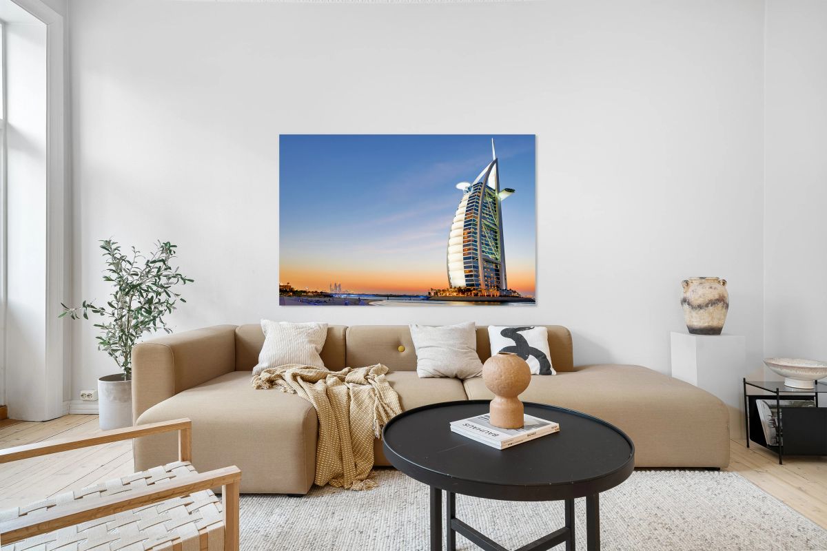 Burj Al Arab shines during sunset in Dubai UAE