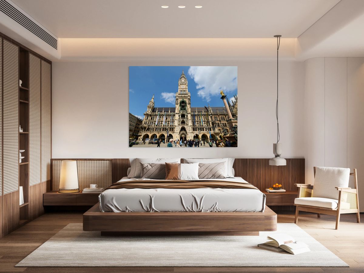 Tourists explore Munichs town hall in Marienplatz on a sunny da