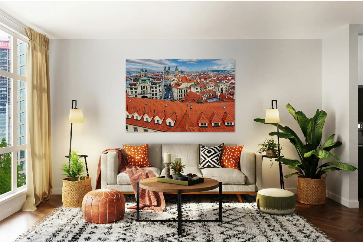 Panoramic view of Pragues red roofs and historic skyline.