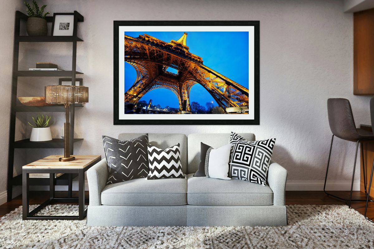 Eiffel Tower stands bright against darkening sky in Paris