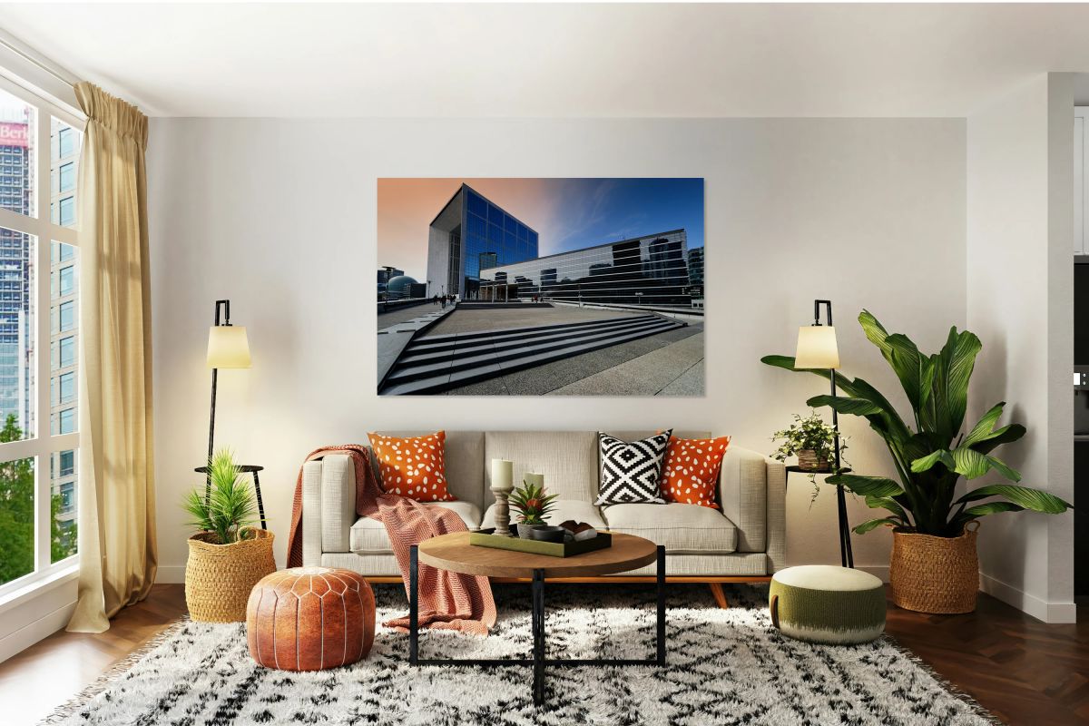 Visitors explore La Defense in Paris during a bright afternoon