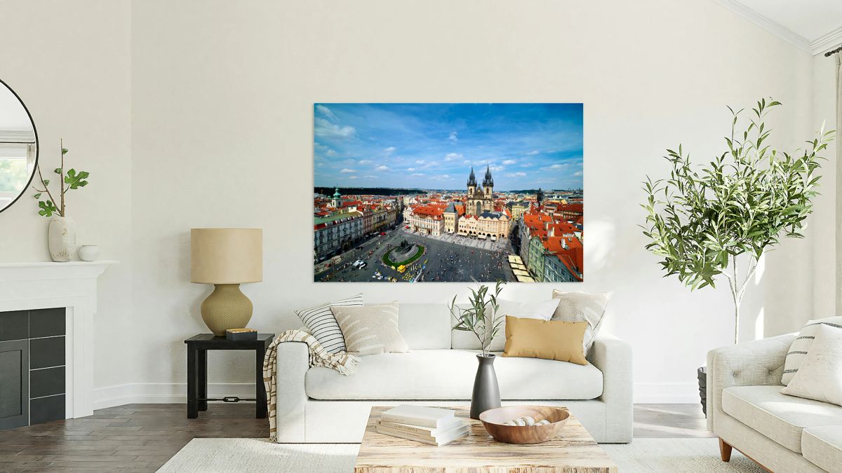 Aerial view of bustling Prague Old Town Square and Týn Church.