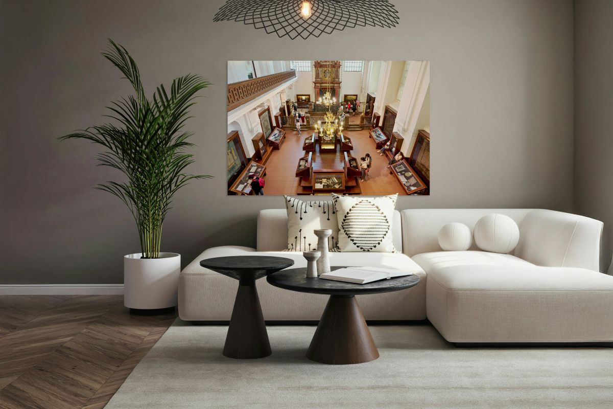 People explore a grand museum or synagogue with historical exhib