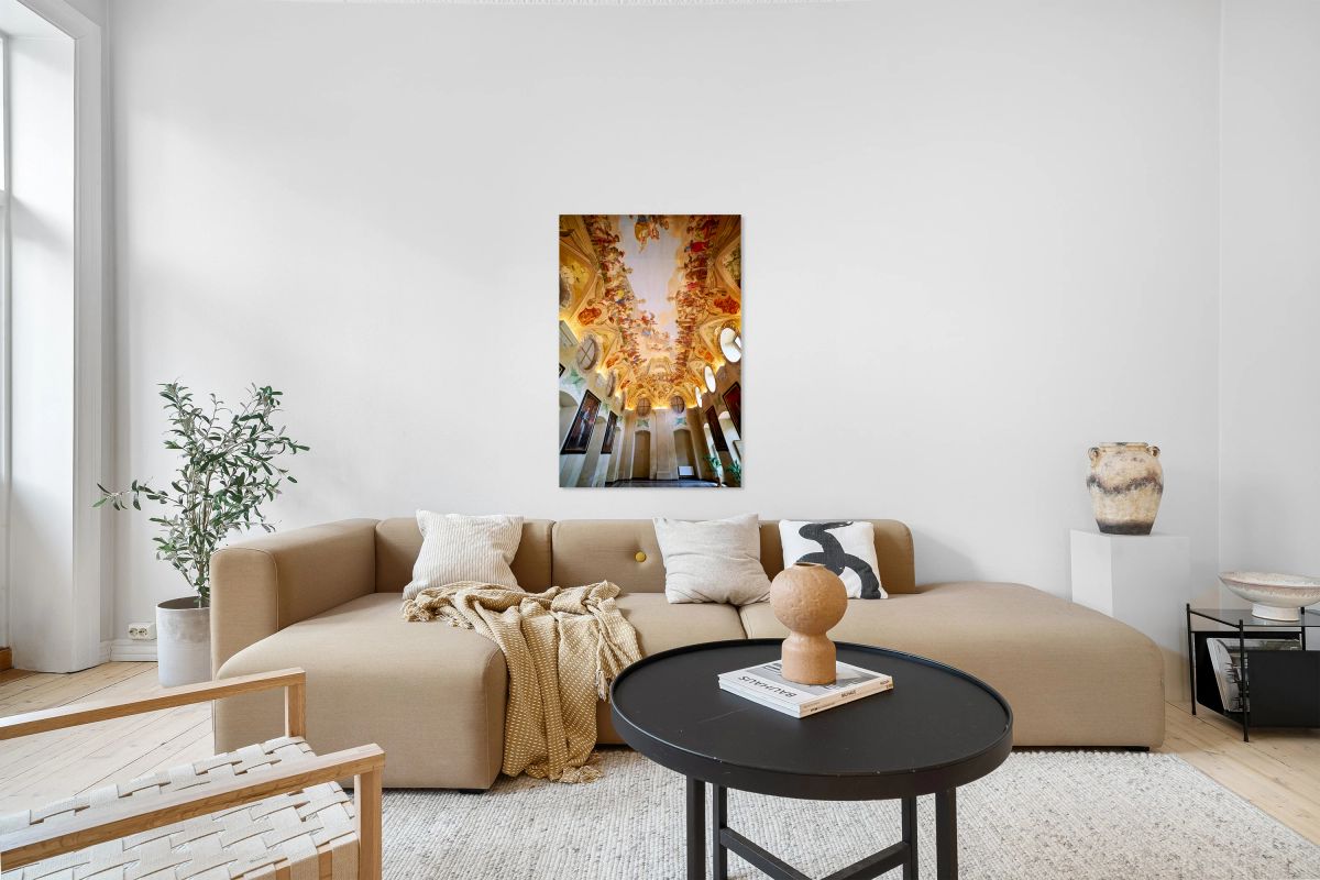 Grand hall with elaborate Baroque ceiling frescoes and wall art.