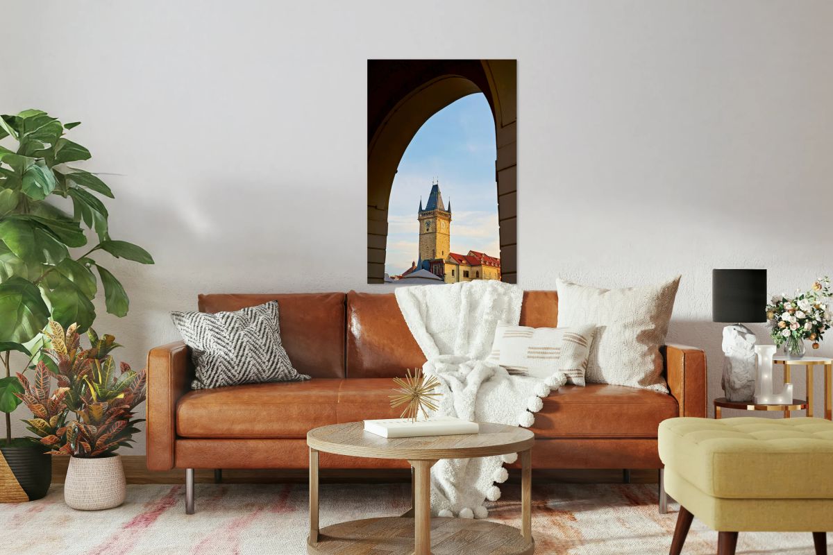 Historic clock tower framed by an archway.