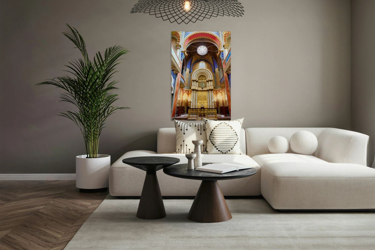 Ornate synagogue interior with golden ark and colorful decoratio