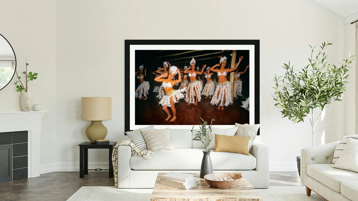 Women perform traditional dance in feathered costumes on Easter 