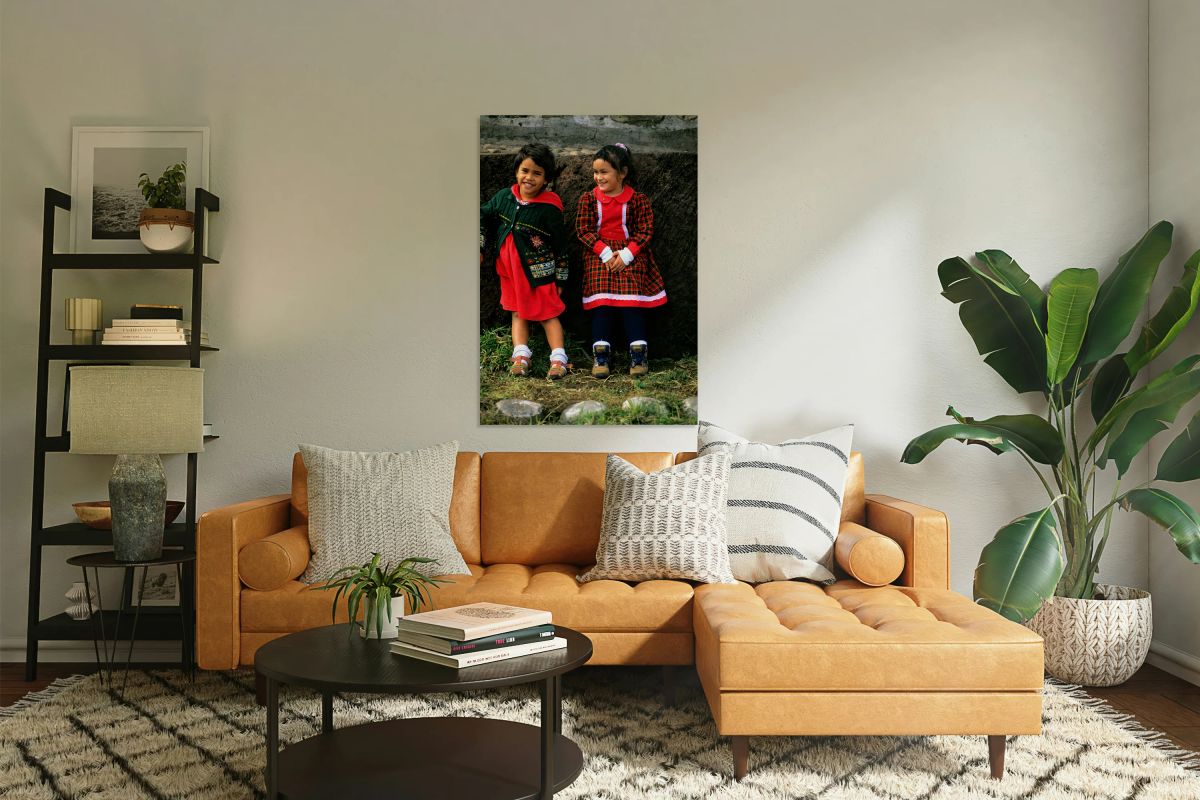 Two young girls smiling dressed in colorful outfits at Easter I