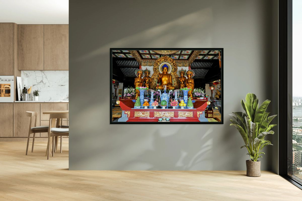 Visitors observe golden statues in Shanghai Buddhist temple inte