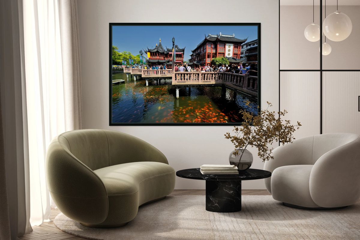 Crowds gather in traditional Chinese garden with fish pond in Sh