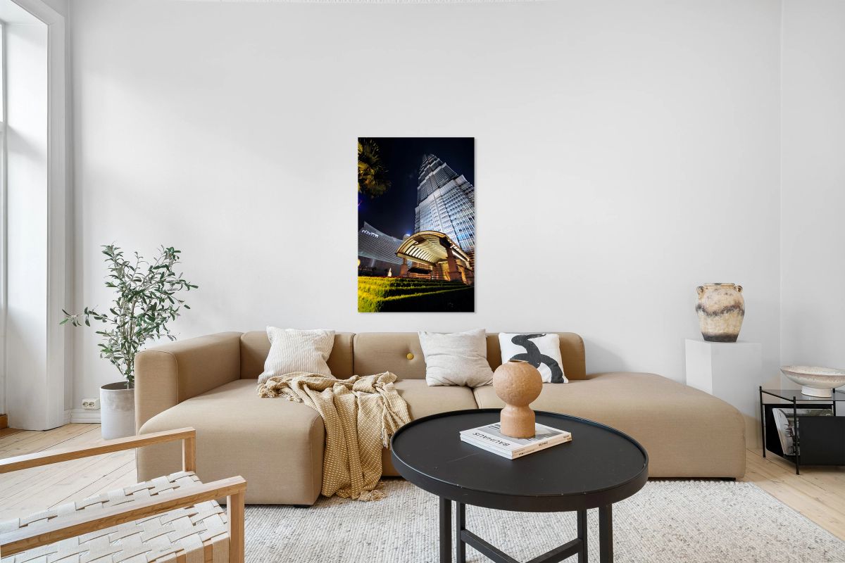 Modern skyscraper with bright entrance at night in Shanghai