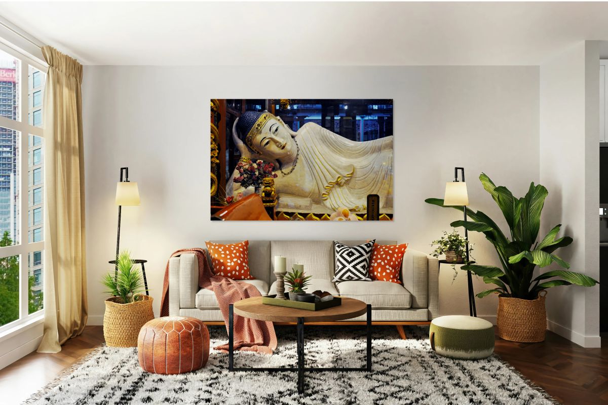 Reclining Buddha statue in Shanghai temple with flowers and gold