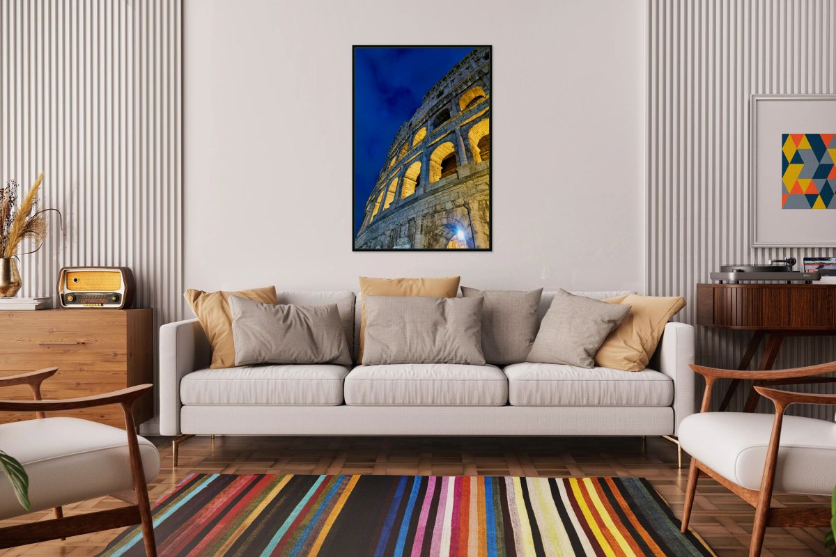 Colosseum in Rome at night with lights shining on the structure