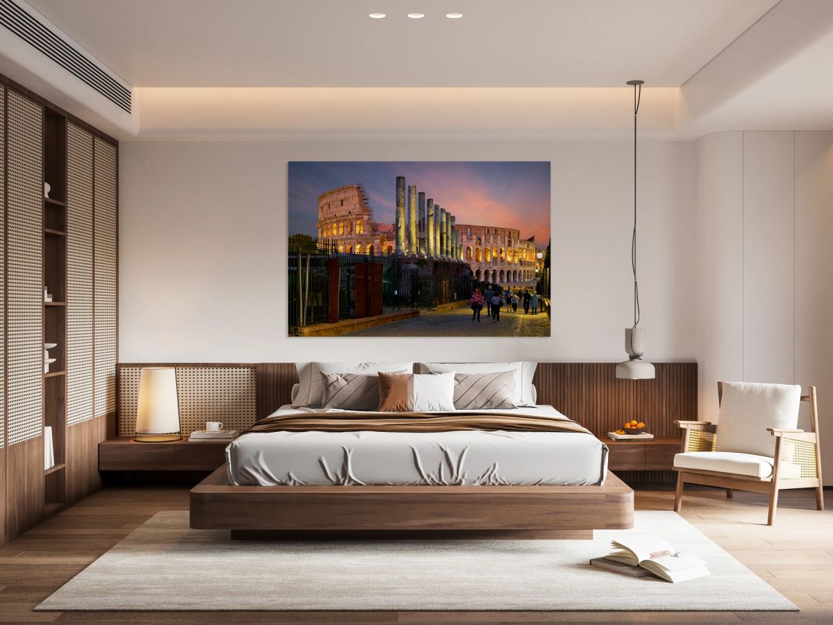 Visitors walking near the Colosseum in Rome at dusk