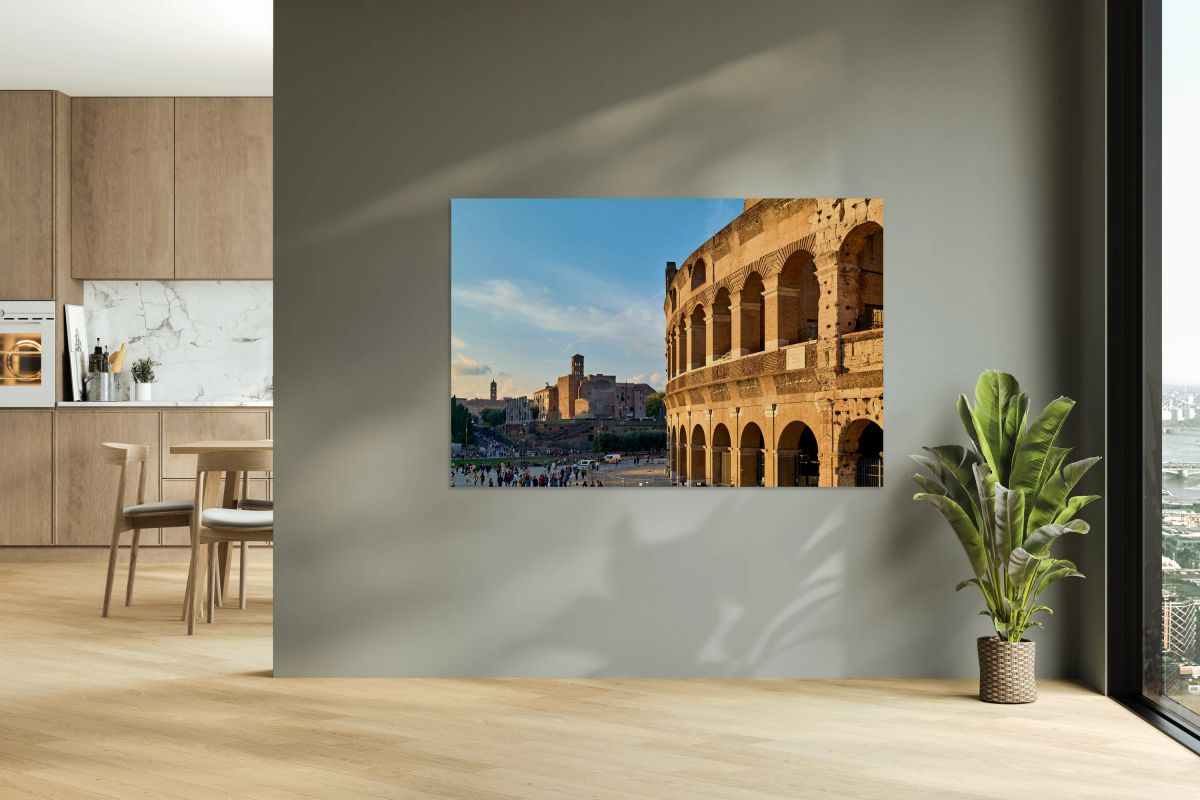 Colosseum stands in Rome with visitors exploring nearby
