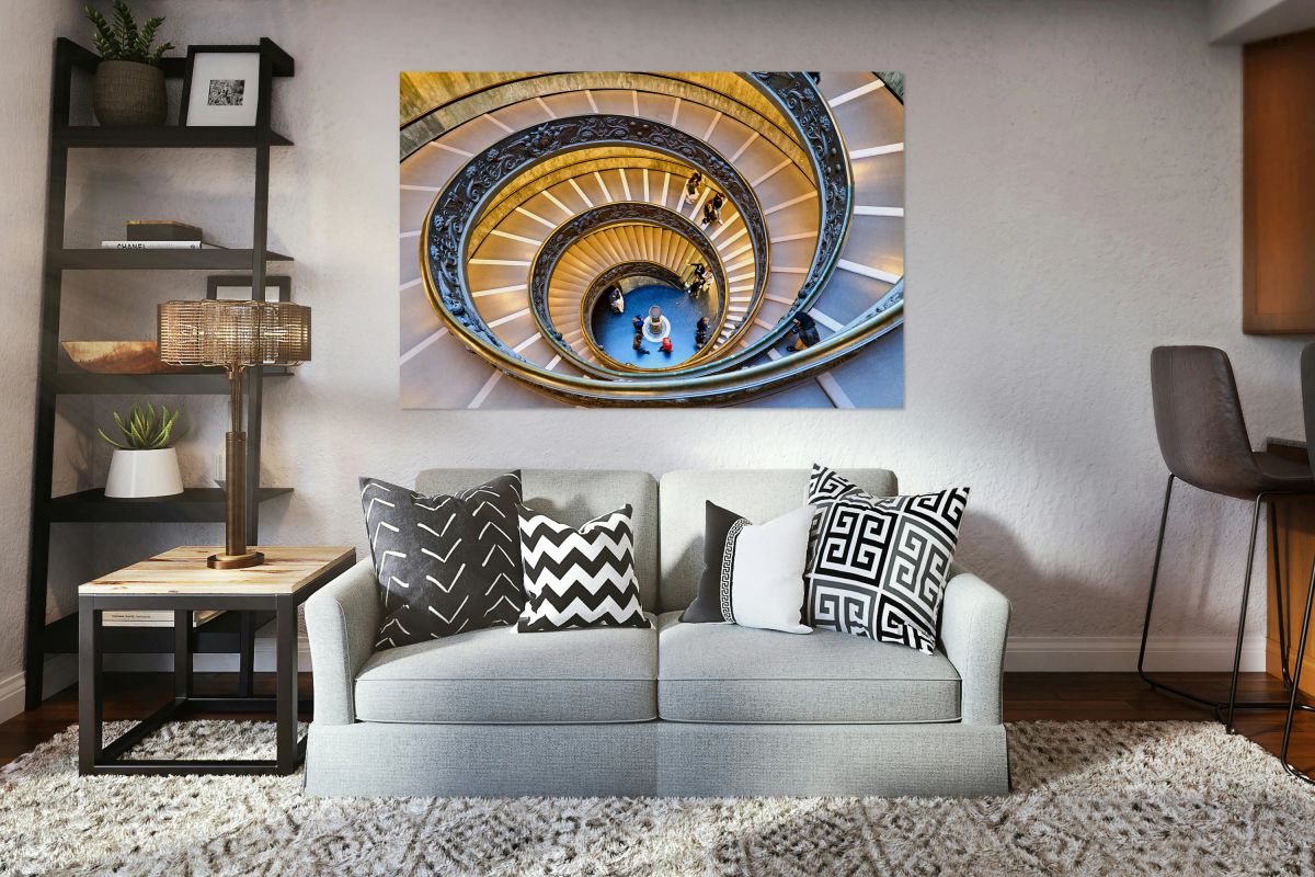 Visitors walk down Bramante staircase in Vatican Museums in Rome