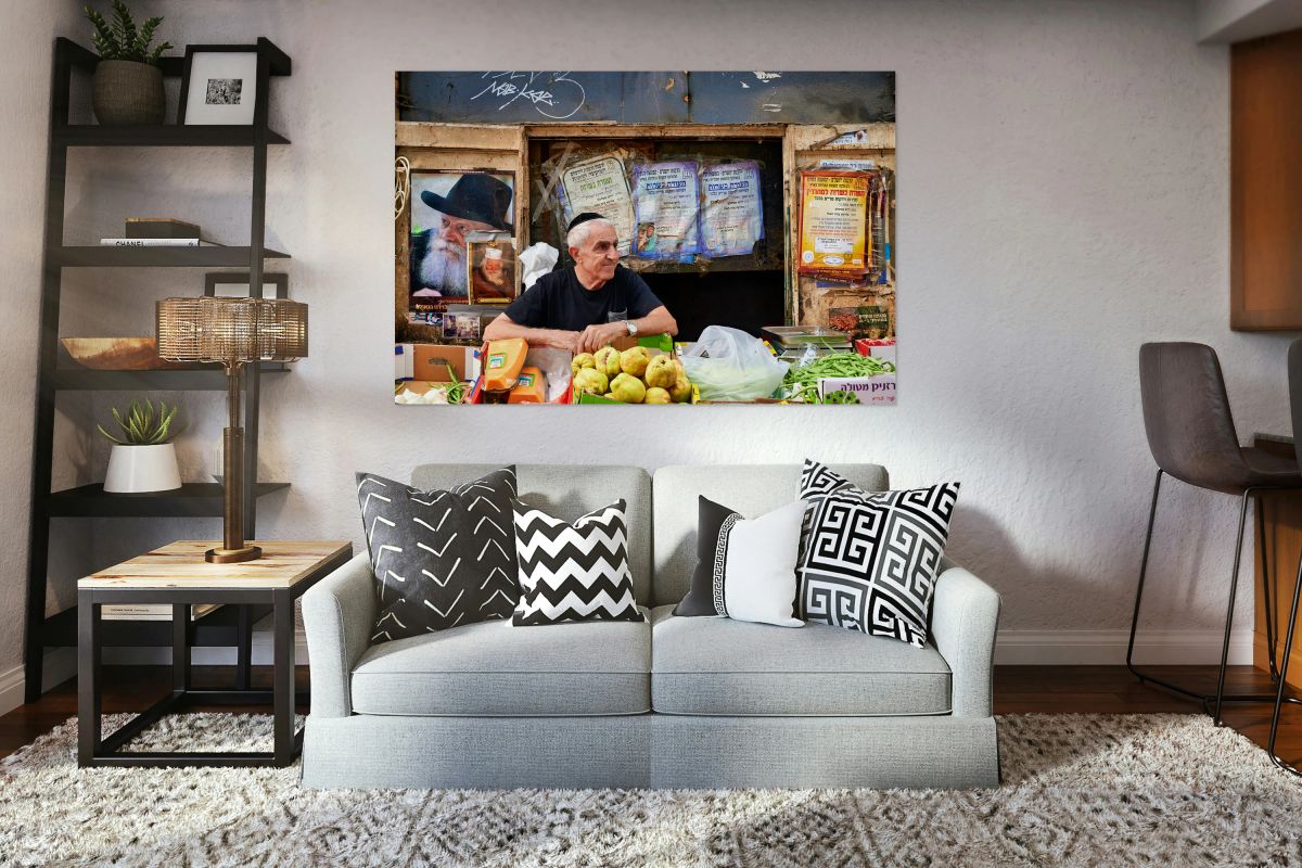Man selling fruits in Mahane Yehuda Market in Jerusalem Israel