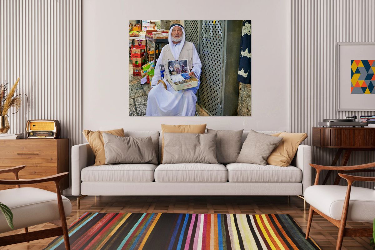 Beggar in the old city of Jerusalem seeks help from passersby