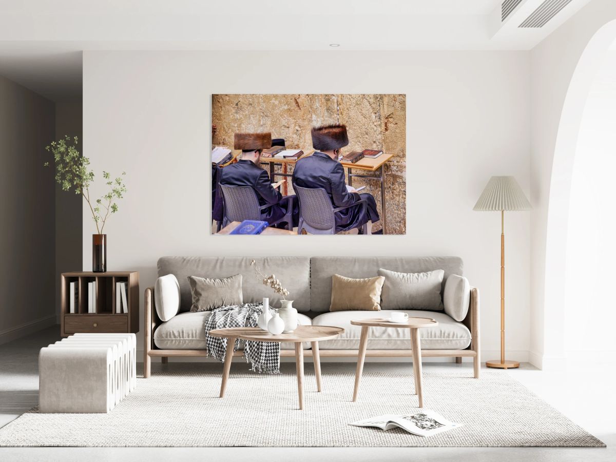 Orthodox Jews sit at tables by the Western Wall in Jerusalem