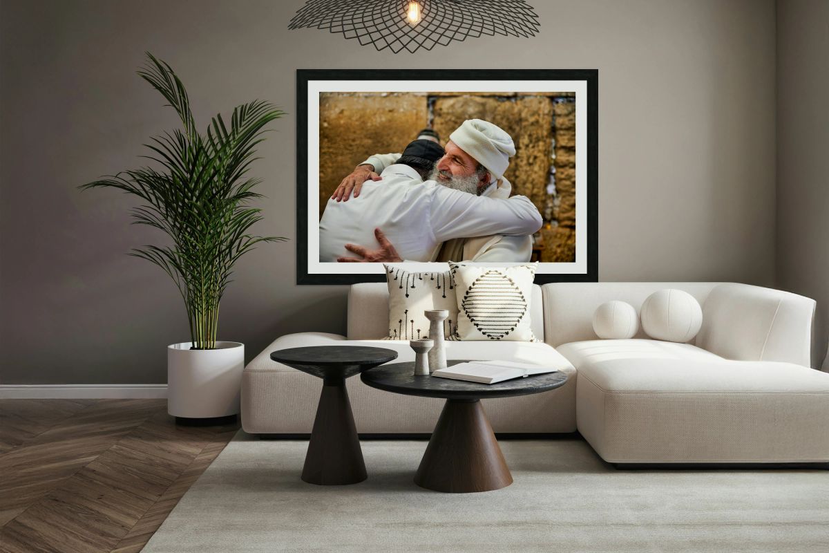 Men embrace each other at the Wailing Wall in Jerusalem