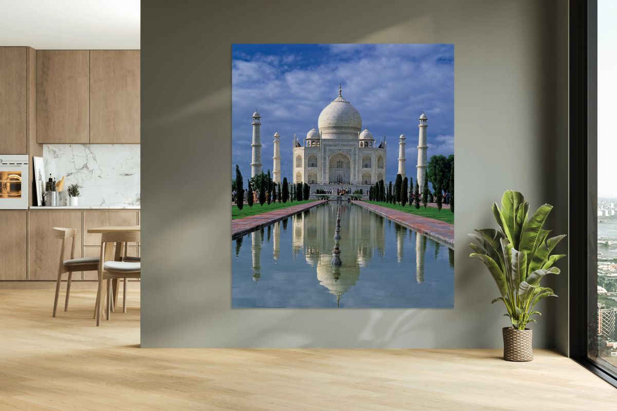 Taj Mahal stands in Agra with clear sky and reflecting pool