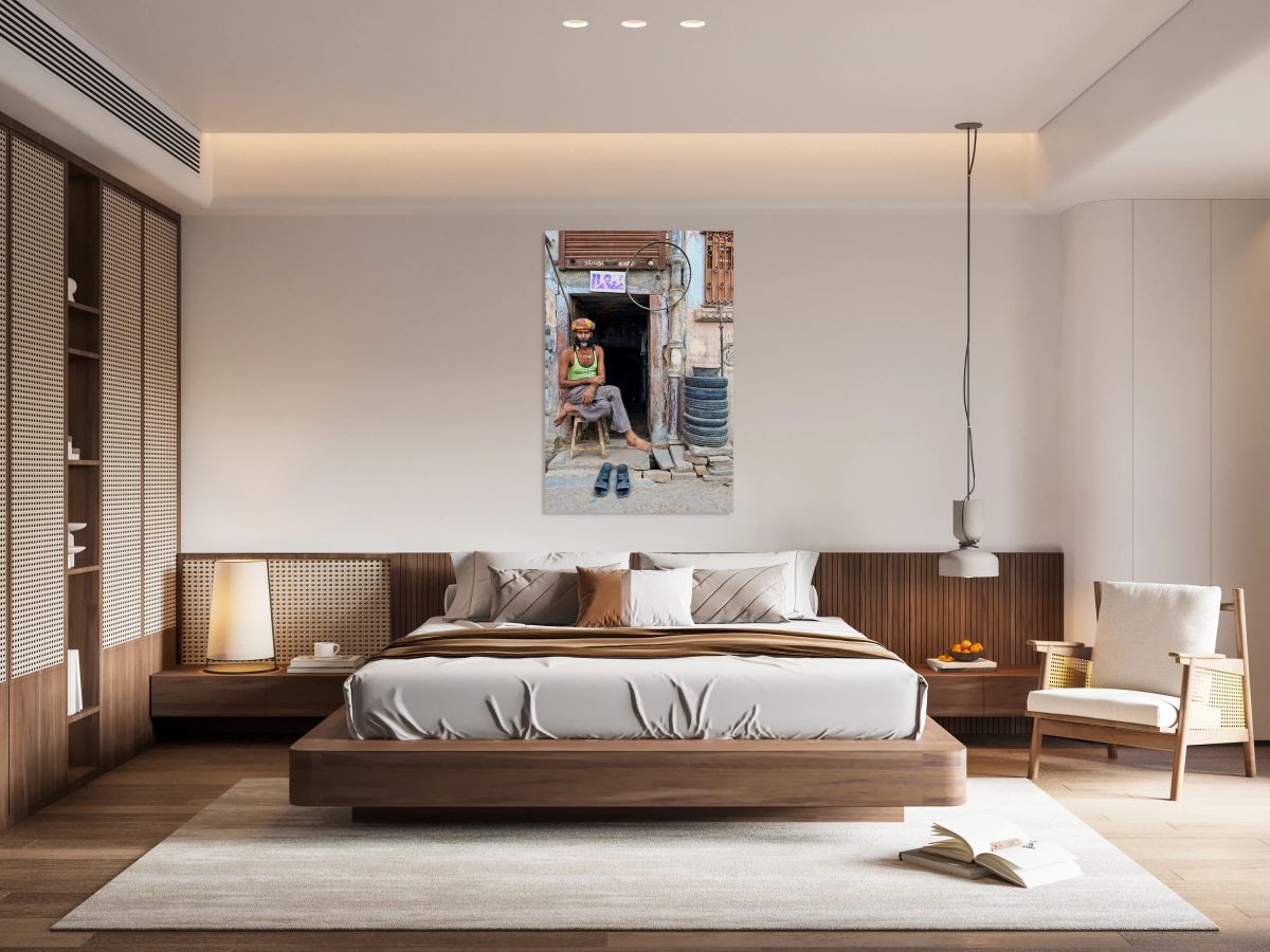 Man sitting outside a shop in Bikaner Rajasthan during the day