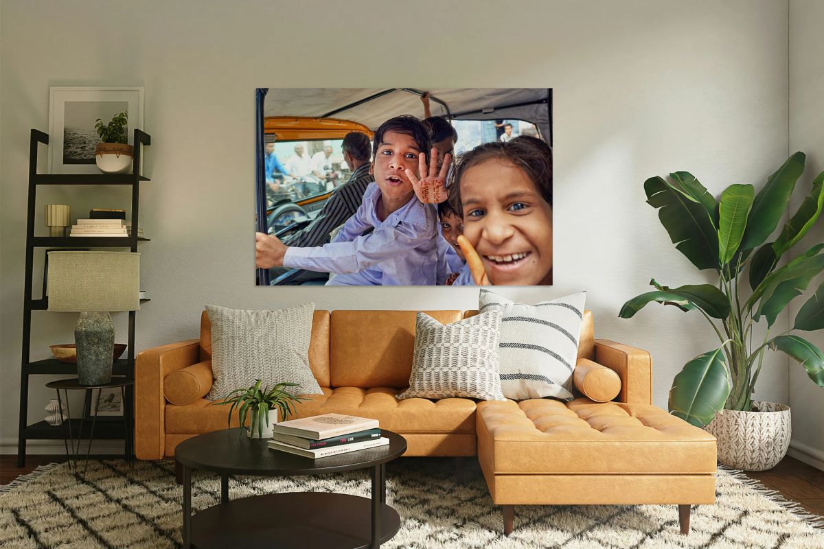 Smiling kids riding in a car in Bundi Rajasthan India
