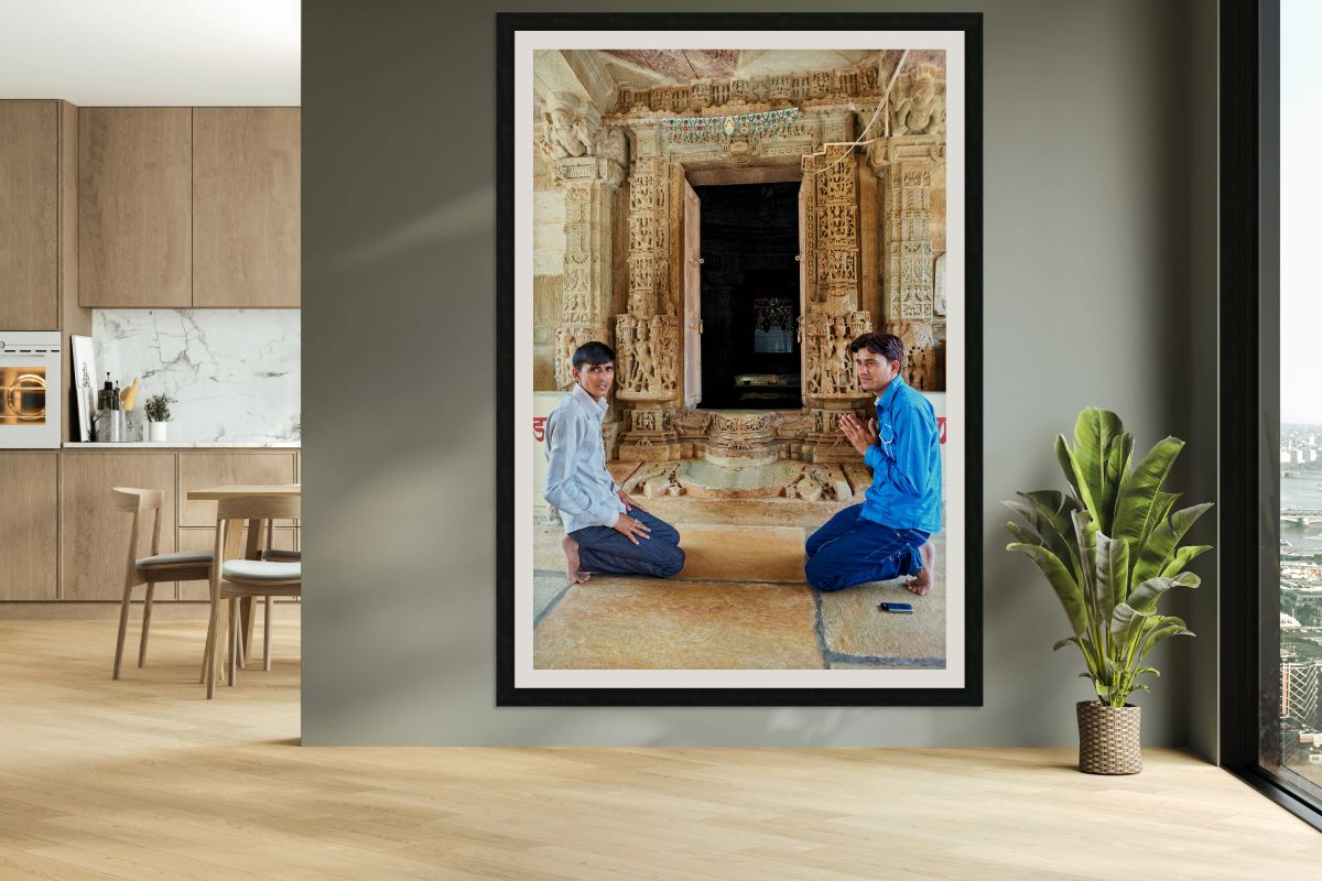 Visitors pray at a temple entrance in Chittorgarh Fort