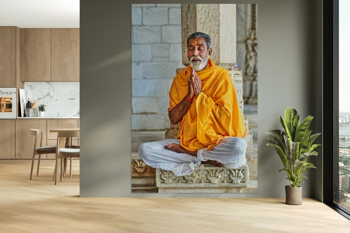 Man prays in Jain temple in Ranakpur Rajasthan during the day