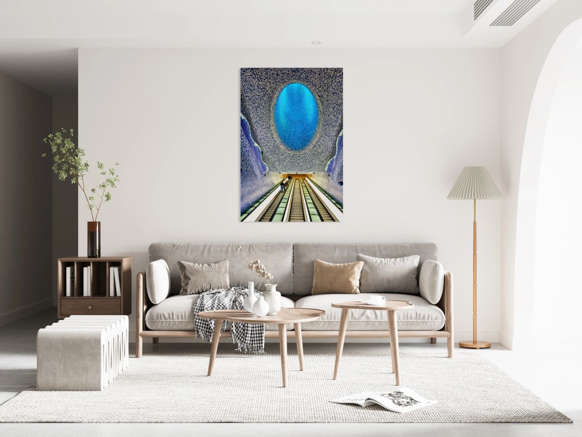 People travel down escalators at Toledo station in Naples Metro