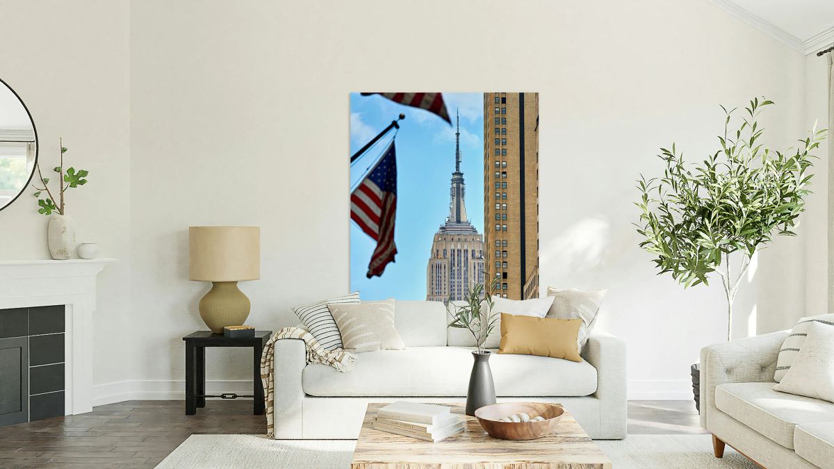 Empire State Building seen with flags in Manhattan New York Cit