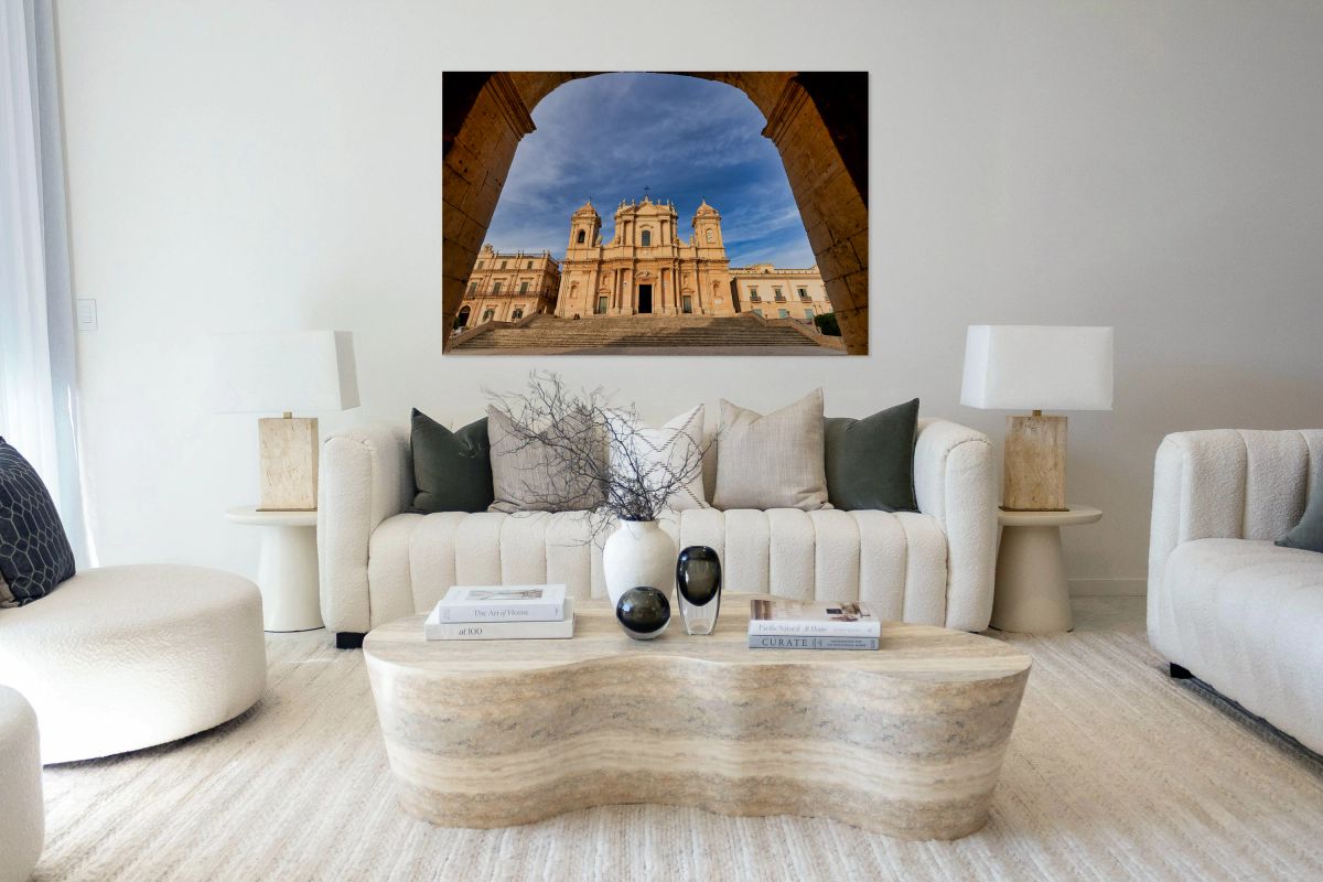 Noto Cathedral stands tall in Noto Sicily with blue sky backdro