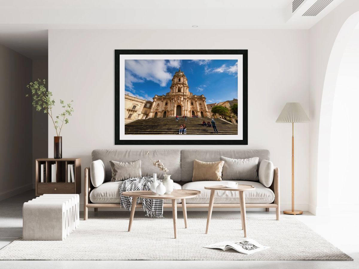 Duomo of San Giorgio stands tall in Modica Sicily under blue sk