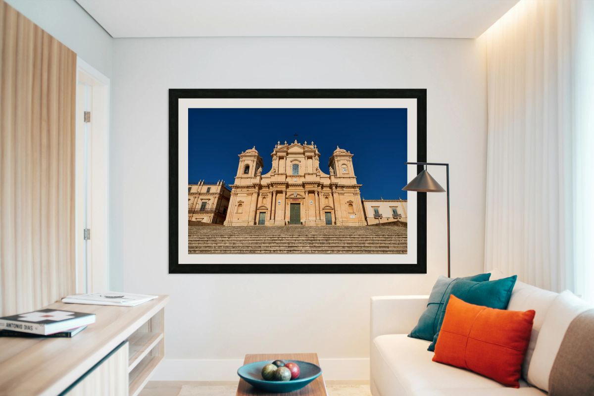 Noto Cathedral stands tall in Sicily under a clear blue sky