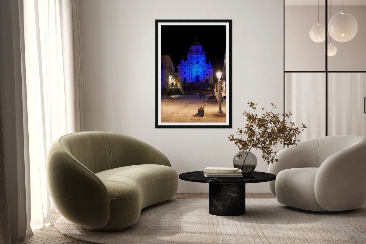 Visitors see Duomo of San Giorgio lit at night in Modica