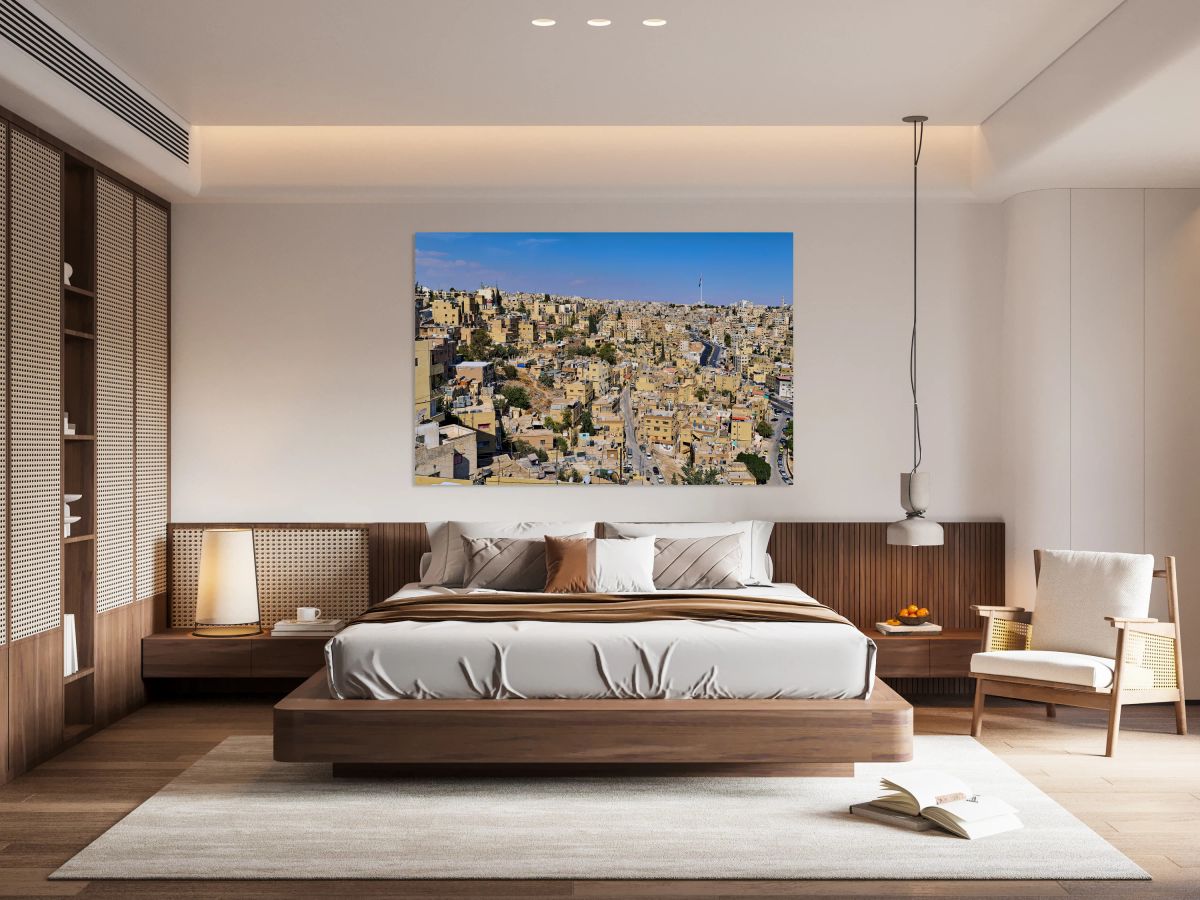 Cityscape of Amman Jordan with buildings and roads under blue sk