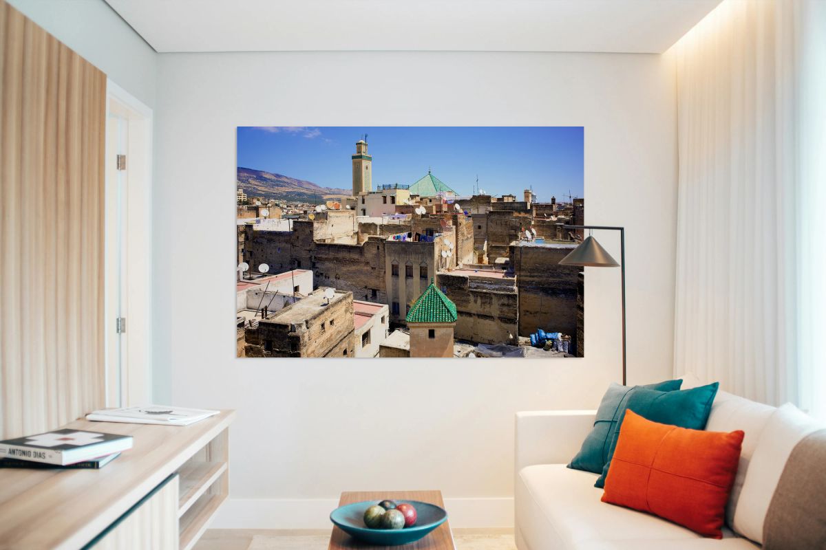 Elevated view of Medina in Fez Morocco with rooftops and mounta