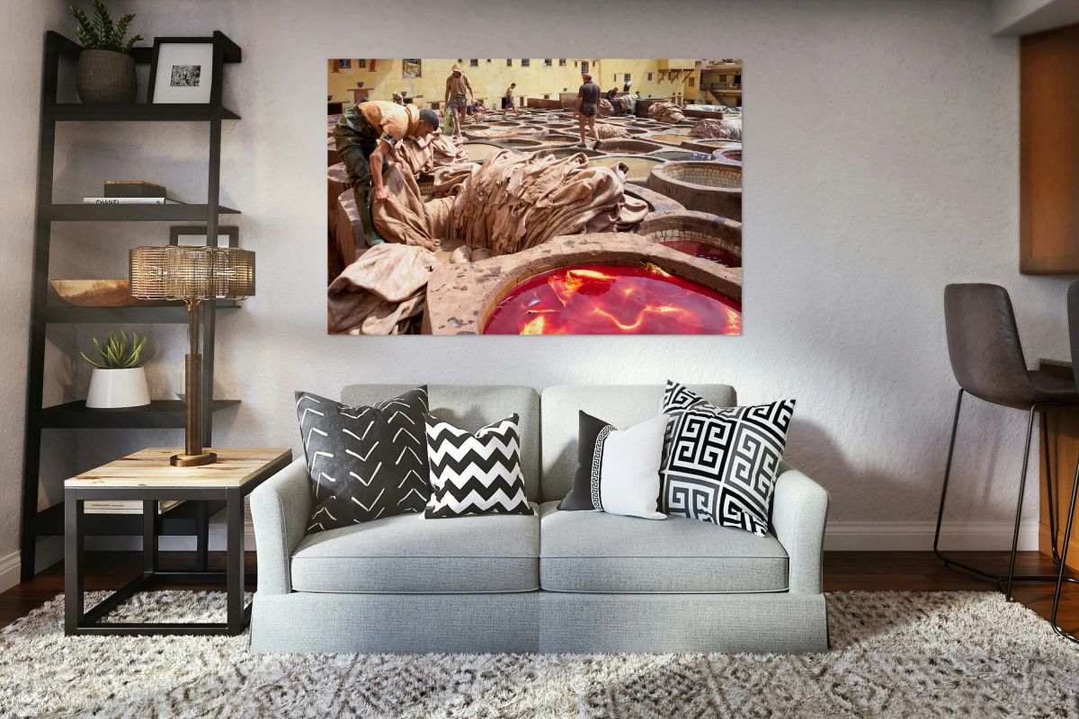 Workers dye leather at Chouara Tannery in Fez Morocco during the