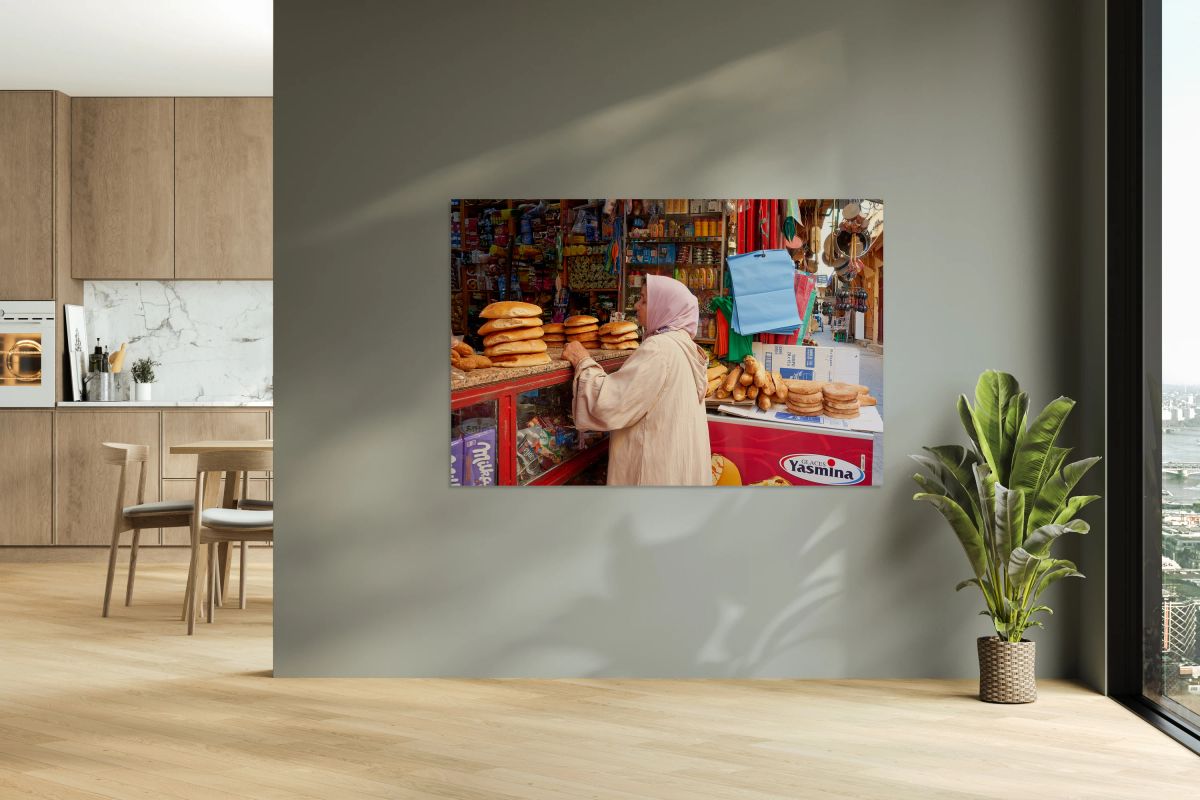 Woman buys bread in Fez Medina market