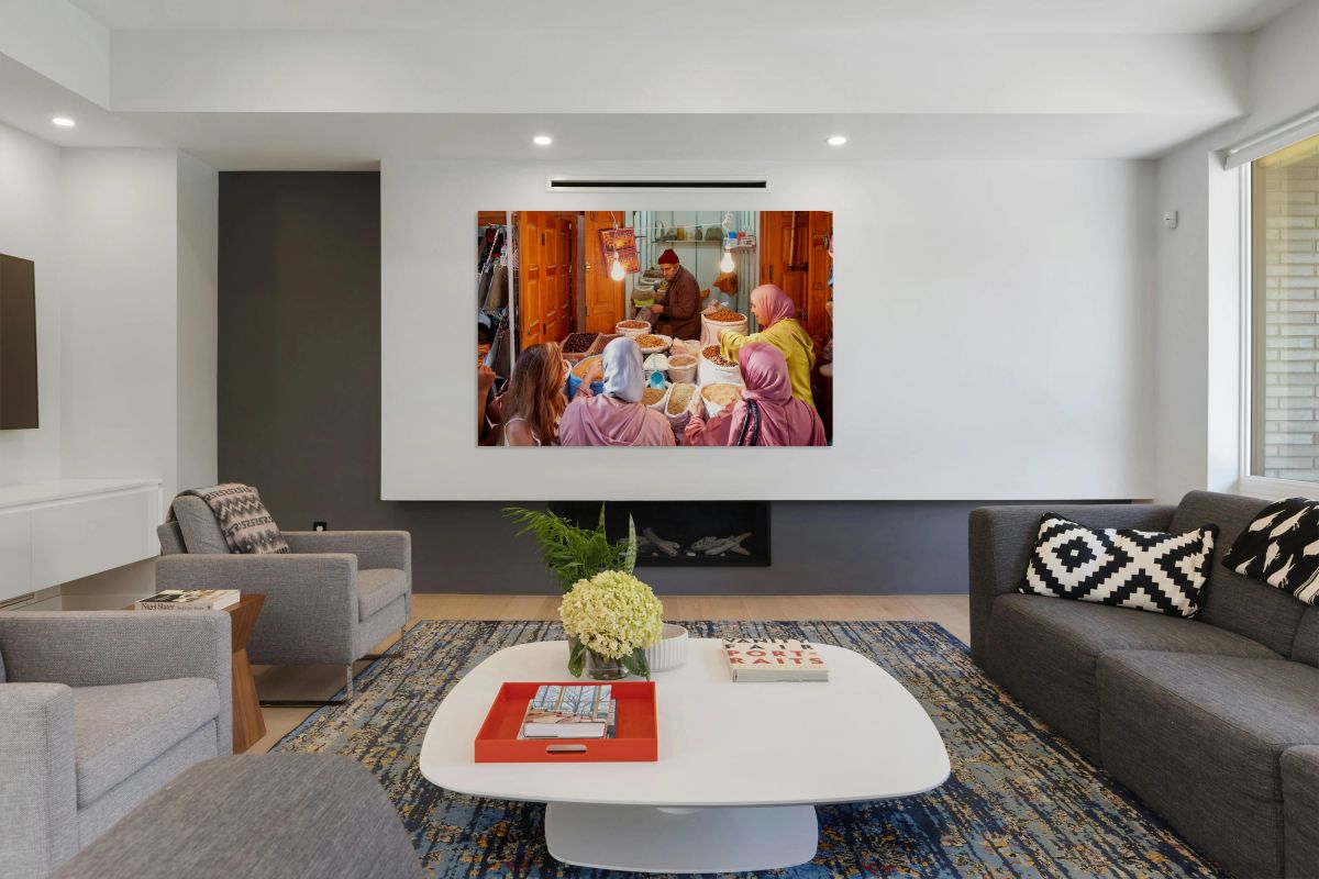 Dried fruit market in Fez Medina with local customers and vendor
