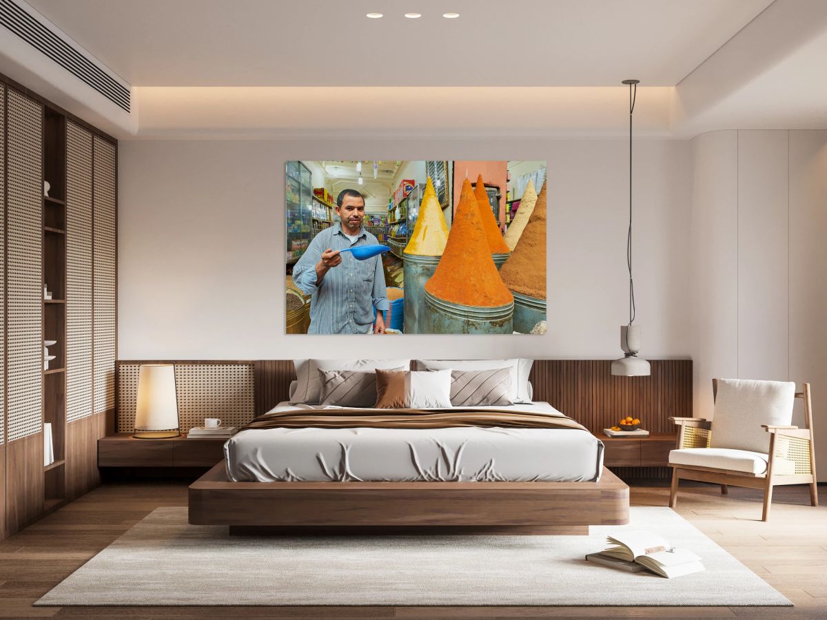 Sale of spices in Marrakesh souk with vendor showing products