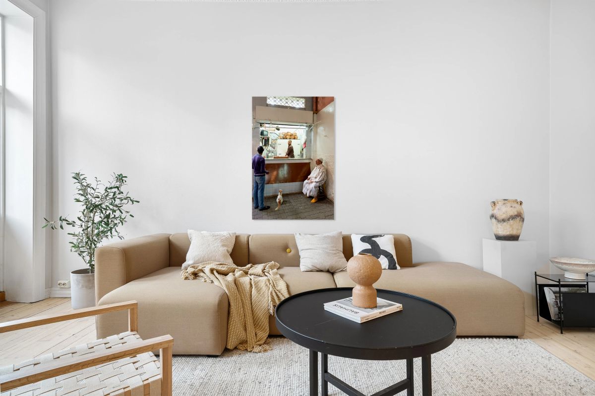 Busy shop in Marrakesh souk with local vendors and customers