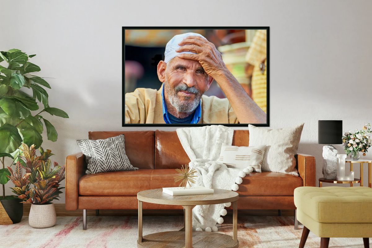 Man smiles at market in Marrakesh Morocco in bright daylight