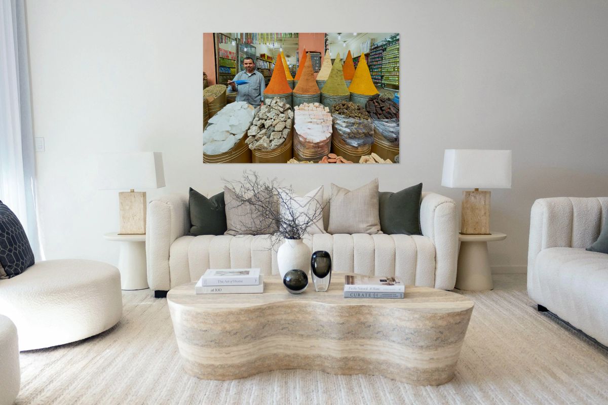 Spice seller in souk of Marrakesh shows colorful spices in Moroc