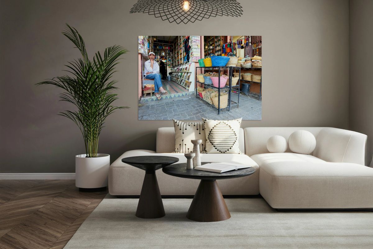 Shops in the Medina of Marrakesh with local vendor and baskets